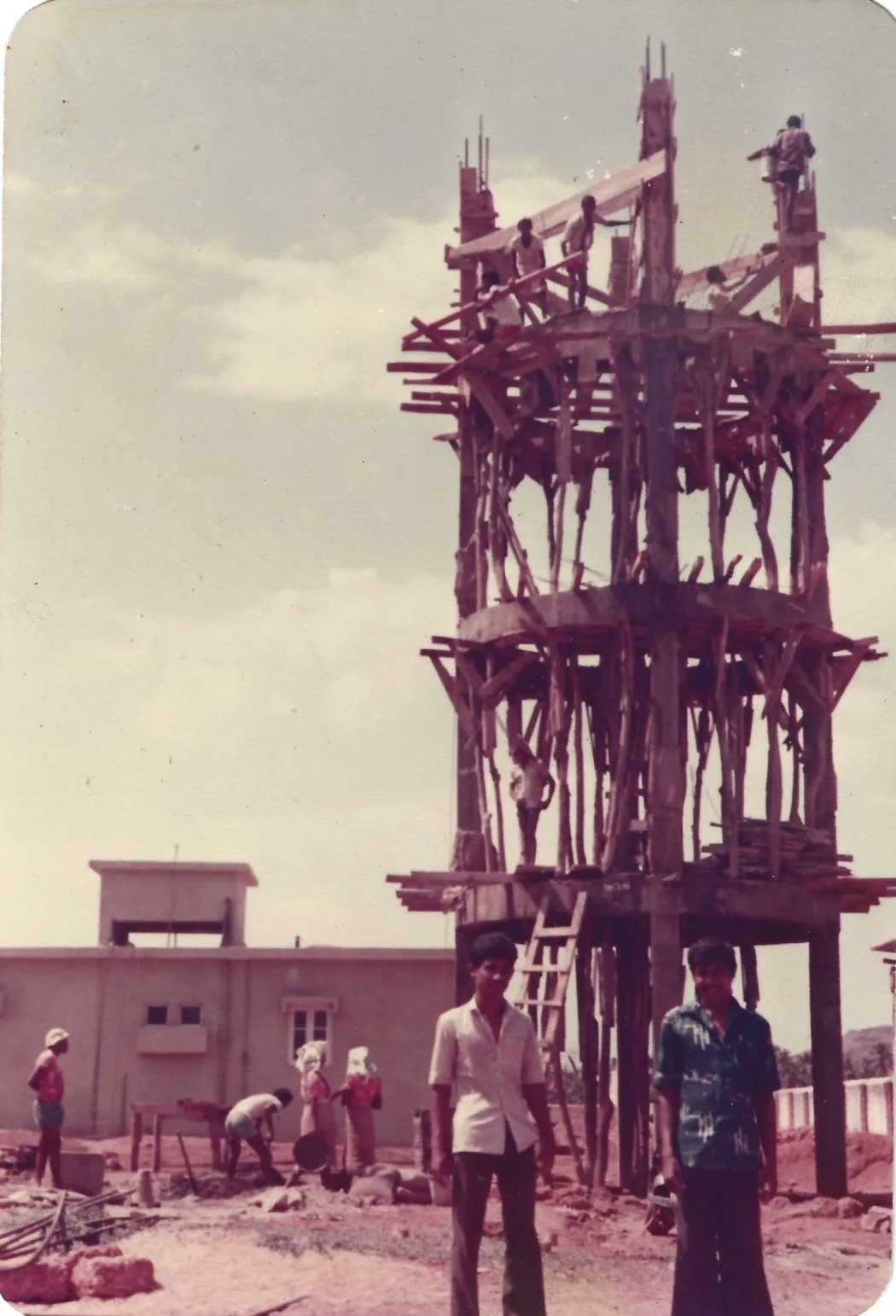 An overhead water tower rising on timber centring