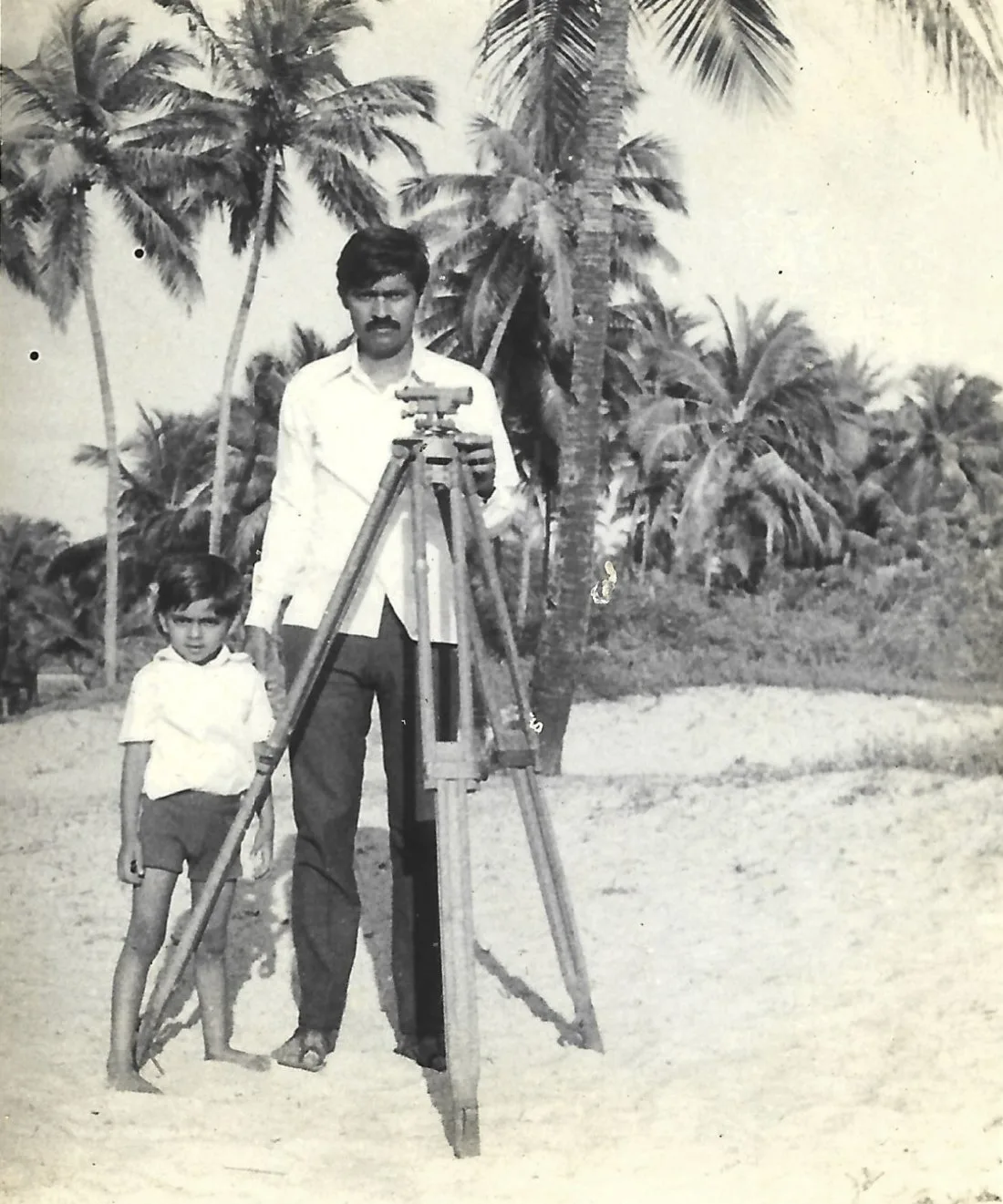 Surveying a coastal plot with a dumpy level, the next generation alongside